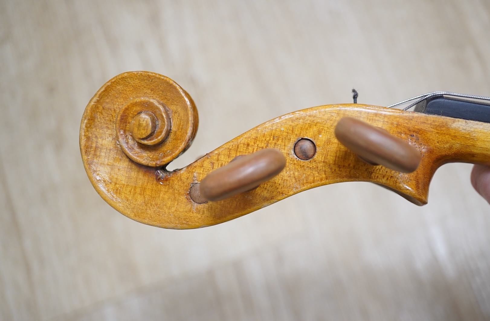 Two cased three quarter size violins, one labelled the London violin Co Ltd, length of back 33.5cm. Condition - both scratched